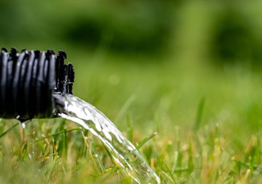 ResidentialSumpPumpDrainLineDischargingWaterIntoGrassYard - Billy The Sunshine Plumber