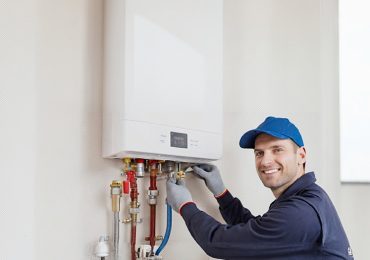 RepairManInstallingTanklessWaterHeater - Billy The Sunshine Plumber