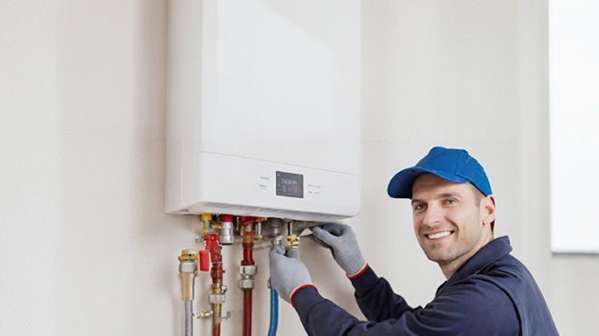 RepairManInstallingTanklessWaterHeater - Billy The Sunshine Plumber